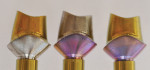 Fig 9. Anodized gold (63 V) for restoration (left); abutment anodized magenta (81 V) for soft-tissue esthetics (center); and dual-anodized abutment (right). All are equally as biocompatible as the non-anodized titanium in Fig 8 but with improved esthetics.