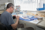 Fig 1. New World Dental Laboratory technician
Simon Rivers stains and glazes zirconia restorations.