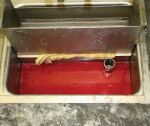 Figure 3  If used as is, a dirty boil out tank can lead to residual wax remaining on teeth after boiling off.