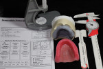 Figure 11  To fabricate the wax rim, the technician needs some valuable information and the proper tools, including a denture gauge, papillameter, caliper, and the dentist’s prescription notes.
