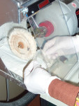 Figure 1. Dental laboratory technician polishing bite splint prior to delivery.
