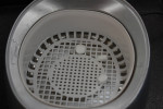 Figure 15. Cleaning the restoration in ultrasonic cleaner.