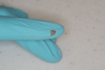 Figure 4 Torn or punctured gloves should be
removed, and hand hygiene repeated before re-gloving.