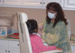 Mary Carmen, RDA, provides oral screenings to young schoolchildren on a field trip to The Children’s Dental Center of Greater Los Angeles’ The Shannon Kelly Toothfairy Cottage.
