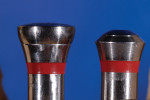 Figure 7 Difference in dimension of standard healing cap (left) and an implant closure screw (right). The standard healing cap has a greater profile and, therefore, displaces more soft tissue.