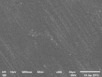 SEM micrographs of the polished surfaces with fine polyurethane rubber polishers of feldspathic, lithium disilicate, and zirconia (original magnification x500), respectively.