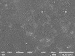 SEM micrographs of the polished surfaces with fine polyurethane rubber polishers of feldspathic, lithium disilicate, and zirconia (original magnification x500), respectively.