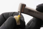 Second lithium disilicate (step 2) polisher point being used on a specimen.