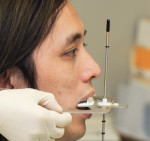 Placement of the dento-facial analyzer to record the occlusal plane orientation.
