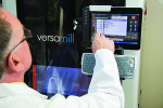 Fig 1. Noel Laboratories INC. CER Steve Barron programs the Versamill 5X200 for use.
