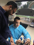 Oscar Galvis, seated, Laboratory Manager at
Roseland, NJ, facility, discusses proper
articulation with Dr. Mark Andrawis.