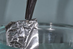 Fig 5. Negative terminal (cathode) is attached to foil placed in electrolyte solution.