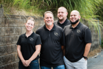 Bill Atkission, owner of Bella Vita Dental Designs in Arden, North Carolina, with his son, Jesus Romero, and technicians Casey Bolt and Kevin Reck.