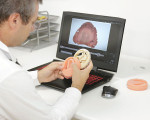 Fig 2. Lucio Lo Russo, DDS, PhD, uses 3Shape Dental System software to design dentures from intraoral scans.