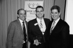 Figure 3  Joseph Radman (center) accepted an award to BIOMET 3i from Larry Coffee (left) and Fred Leviton, both of Dental Lifeline Network.