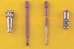 Fig 4. A conventional regular connection impression coping and guide pin (left half of photograph), and the novel verification guide and a regular connection laboratory analog (right half of photograph).
