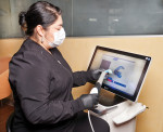 Fig 3. Dental assistant Amanda scans a patient’s denture using the Dentsply Sirona Primescan.
