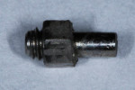 Fig. 4. Hex sheared off of abutment base. The abutment screw is in place. Damage due to excessive polishing is visible. Beveled perimeter appears wider on the right than on the left.