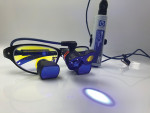 Fig 1. Fluorescence-enhanced theragnosis (FET) device with UV headlight and loupes (2.5x magnification). Hands-free device allows clinician to use both hands for clinical procedures.