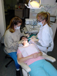 Figure 1  Two primary working postures for the dental assistant: seated and standing.